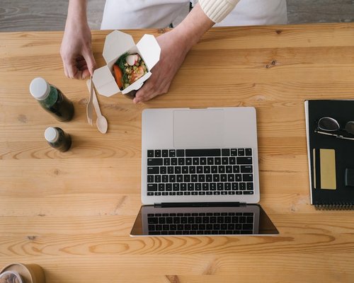 Person eating lunch away from computer